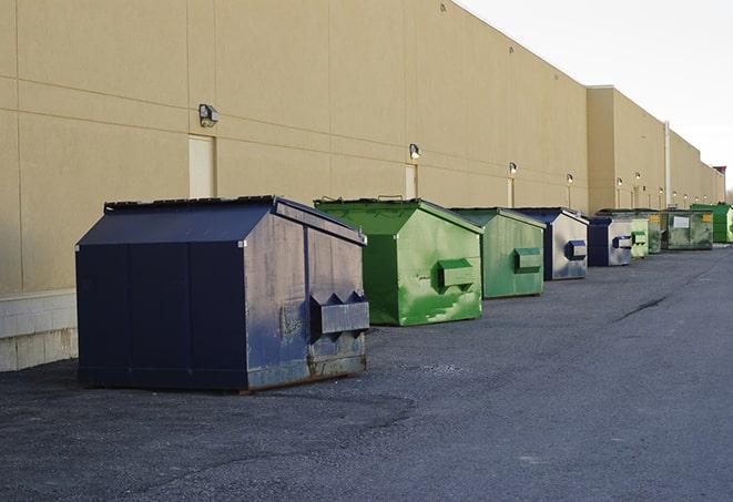 a group of construction workers taking a break near a dumpster in Darien